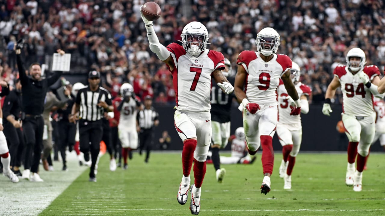 Members of the Arizona Cardinals defense act out a bowling pin strike  dramatization after being hit by a ball rolled by Byron Murphy Jr. who  intercepted a Dallas Cowboys quarterback Andy Dalton