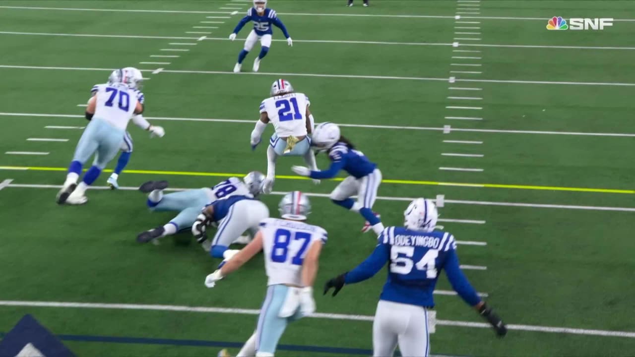 Dallas Cowboys running back Ezekiel Elliott hurdles a defender on his