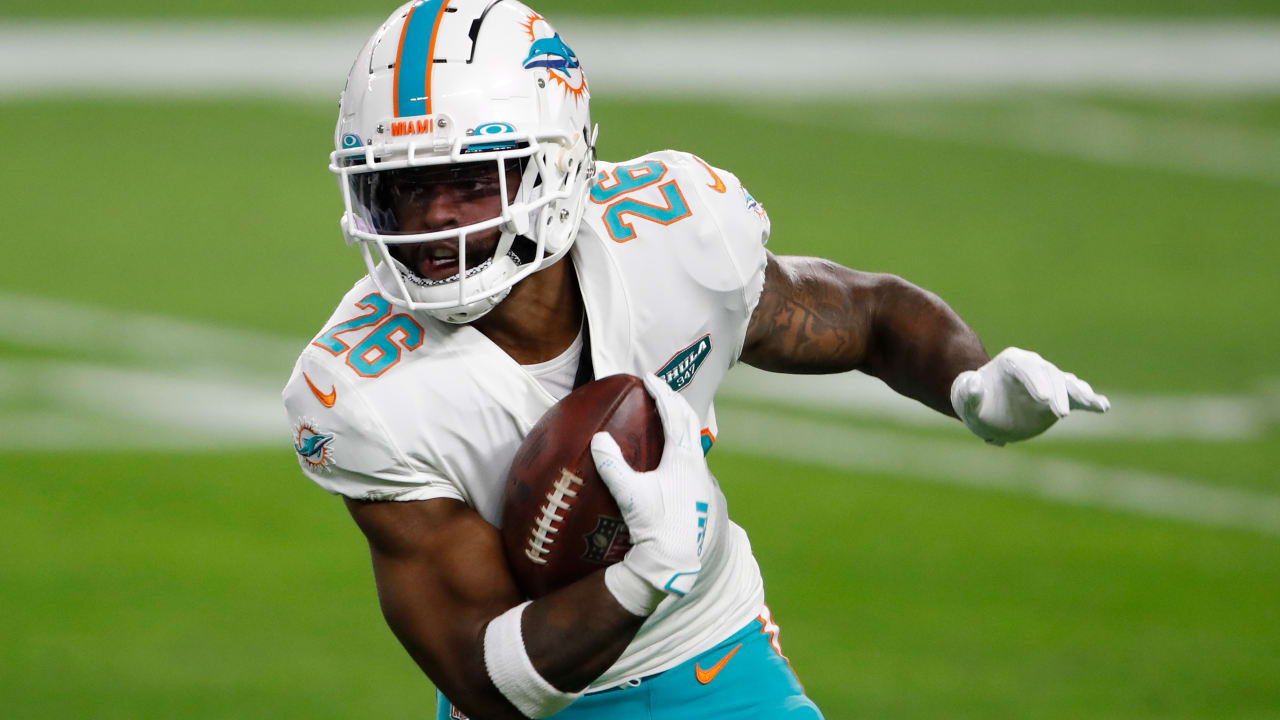 Running back Salvon Ahmed of the Miami Dolphins runs against the Las