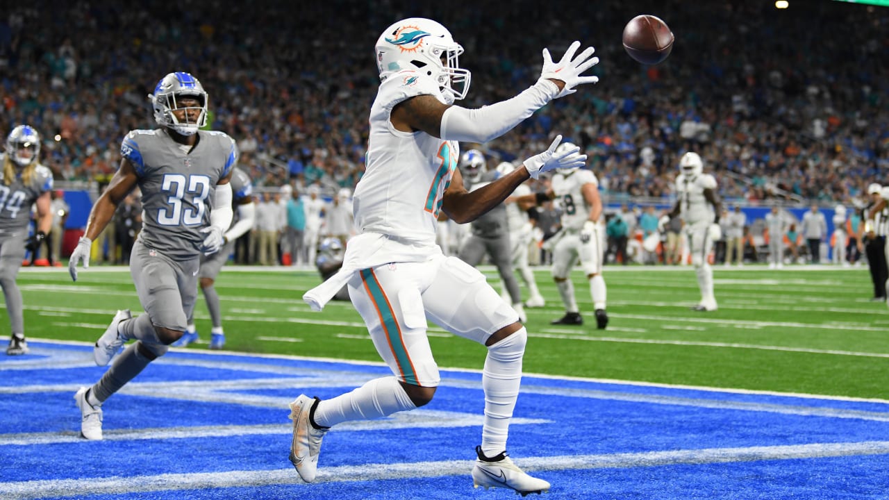 Miami Dolphins wide receiver Jaylen Waddle corrals quarterback Tua