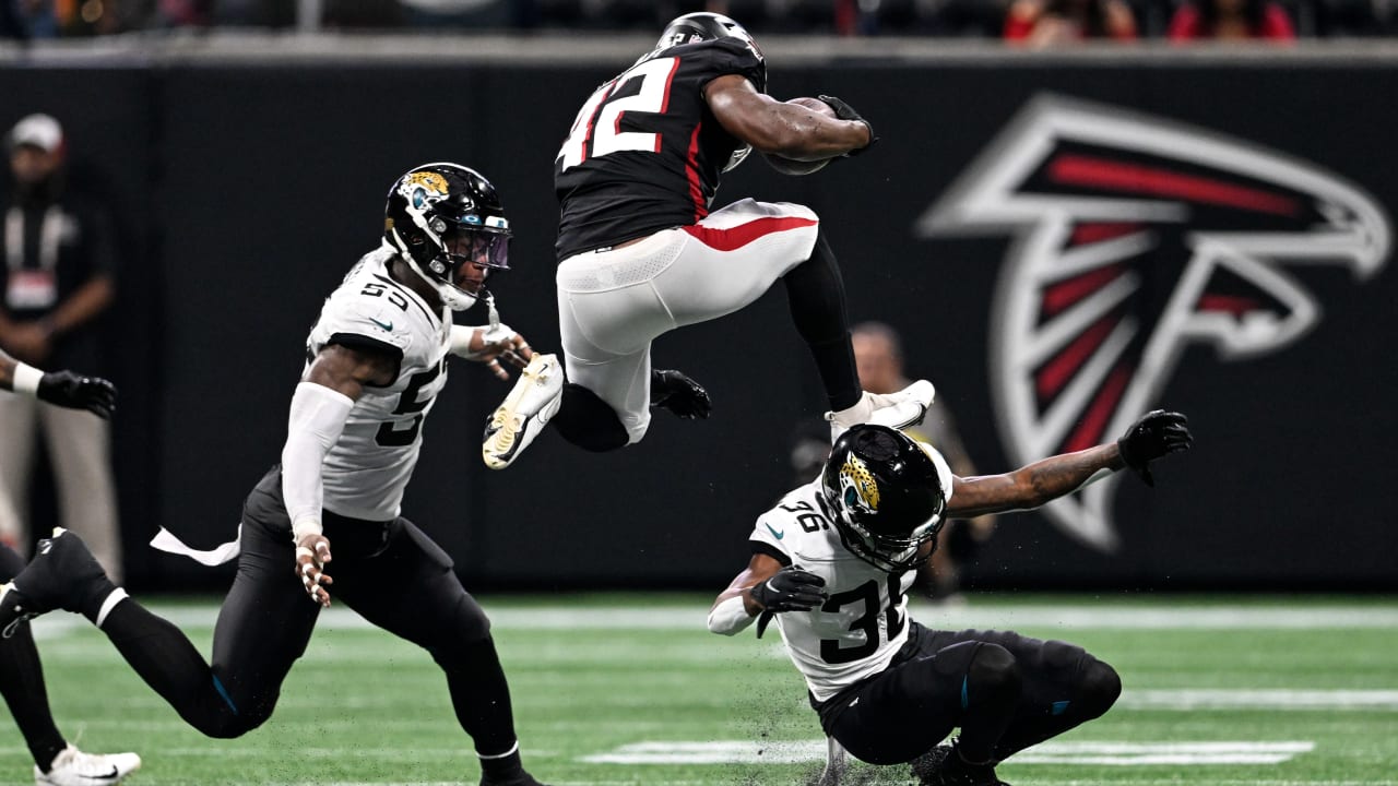 Atlanta Falcons running back Caleb Huntley clears defender on