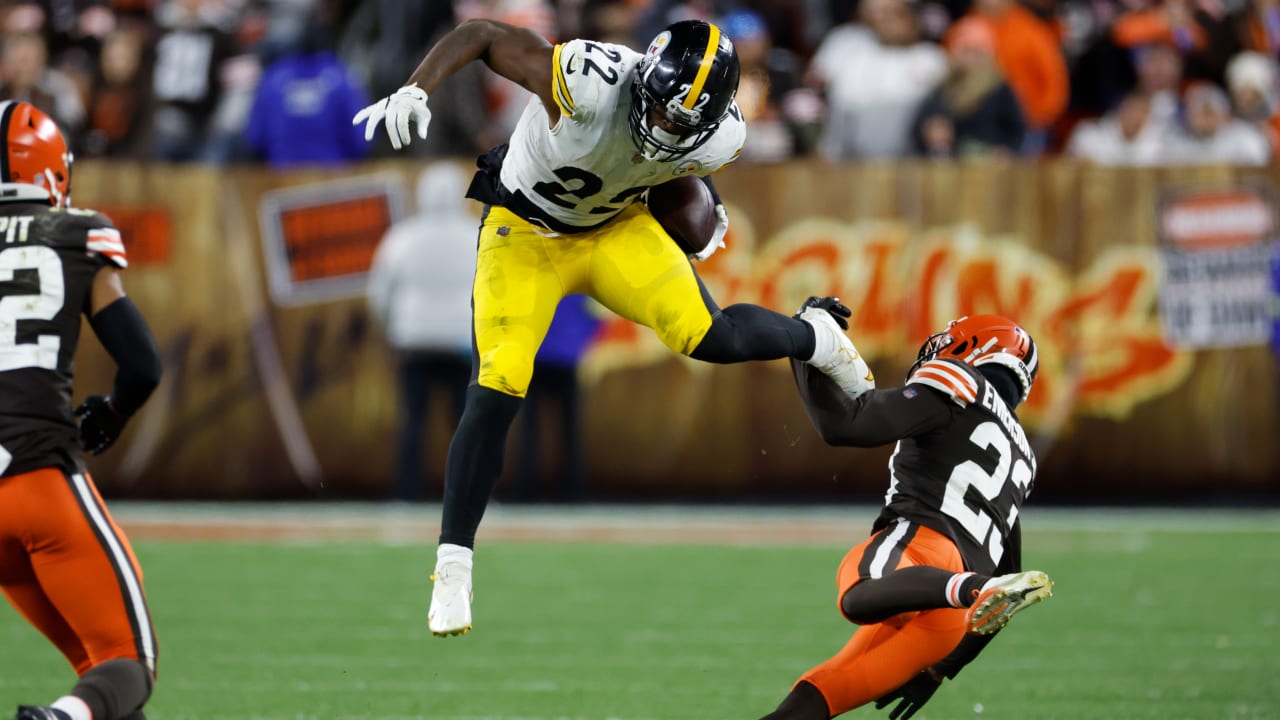Pittsburgh Steelers running back Najee Harris uses his signature hurdle to gain firstdown passage