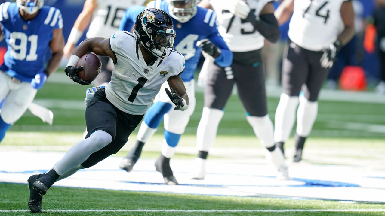 Jacksonville Jaguars running back Travis Etienne Jr., left, and Houston  Texans running back Dare Ogunbowale, right, exchange jerseys after an NFL  football game in Jacksonville, Fla., Sunday, Oct. 9, 2022. (AP Photo/Phelan