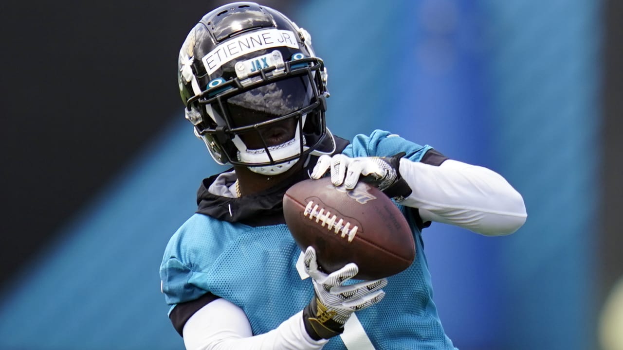 Jaguars' Travis Etienne has Trevor Lawrence's help in attempting to
