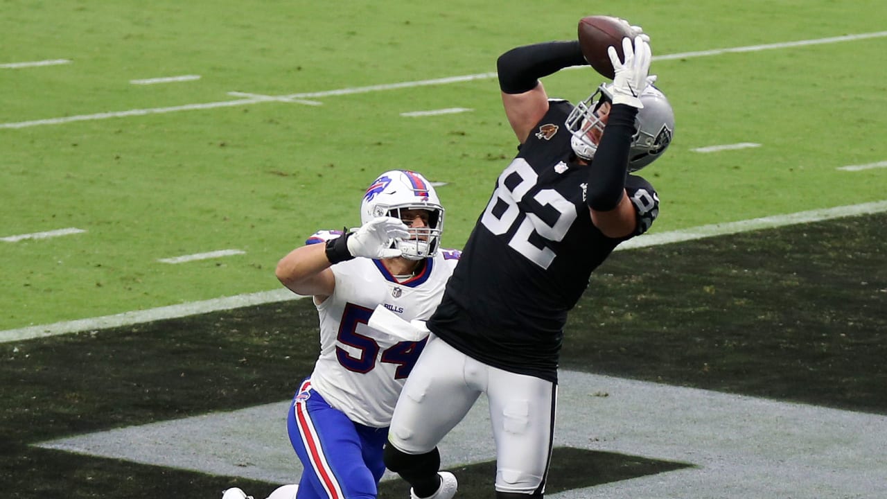 Las Vegas Raiders tight end Jason Witten talks with a coach at the bench  during an NFL football game against the New England Patriots at Gillette  Stadium, Sunday, Sept. 27, 2020 in