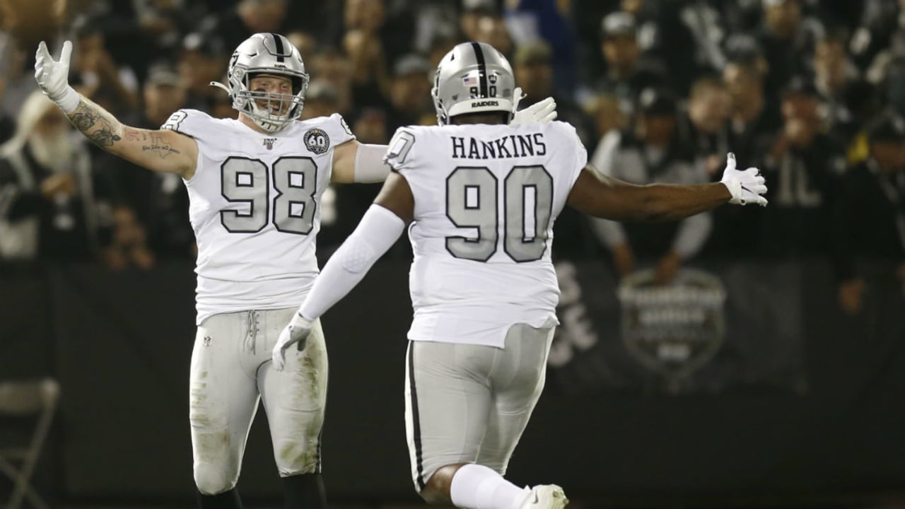 Las Vegas Raiders defensive end Maxx Crosby (98) salutes the crowd in the  first half during an …