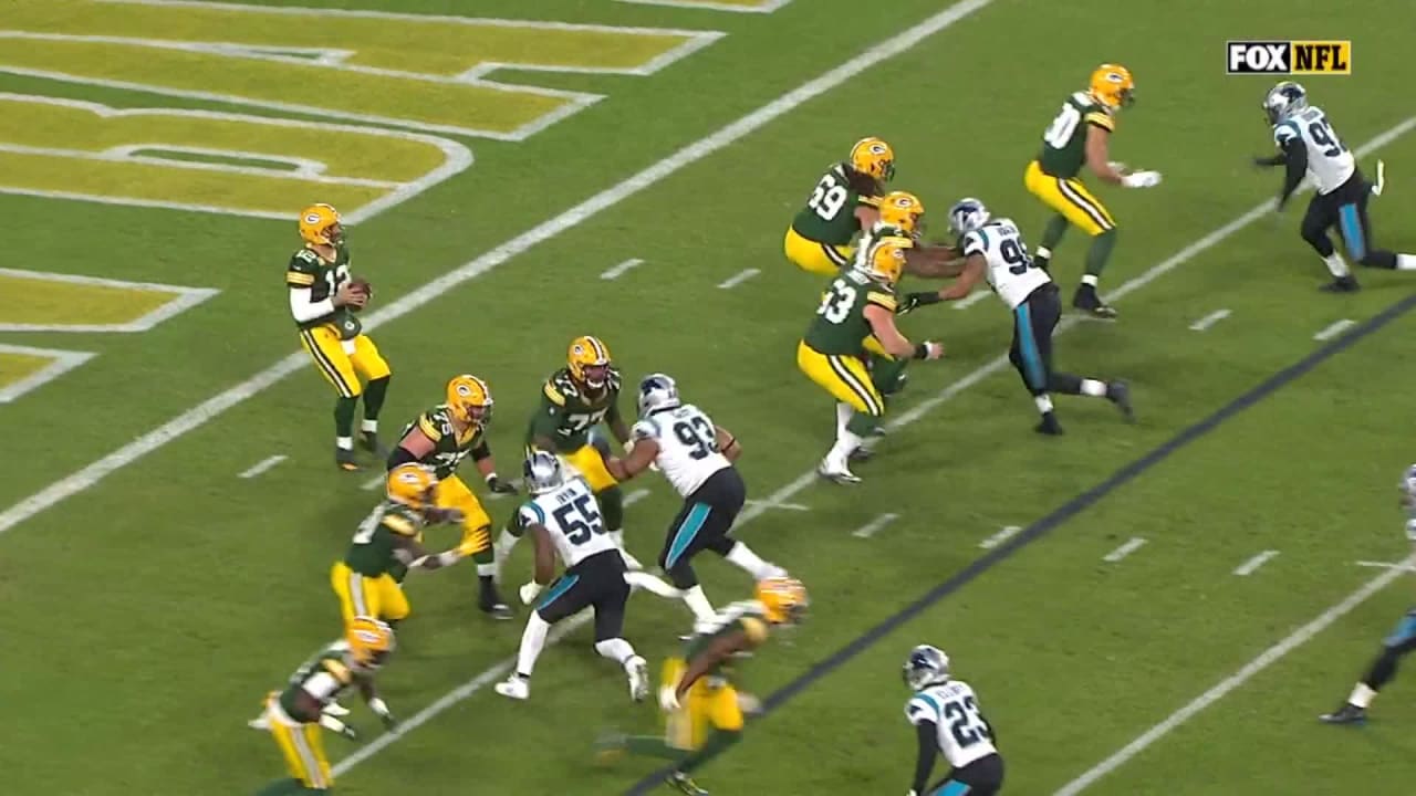 Aaron Rodgers catches flag in hand as he draws roughing passer penalty