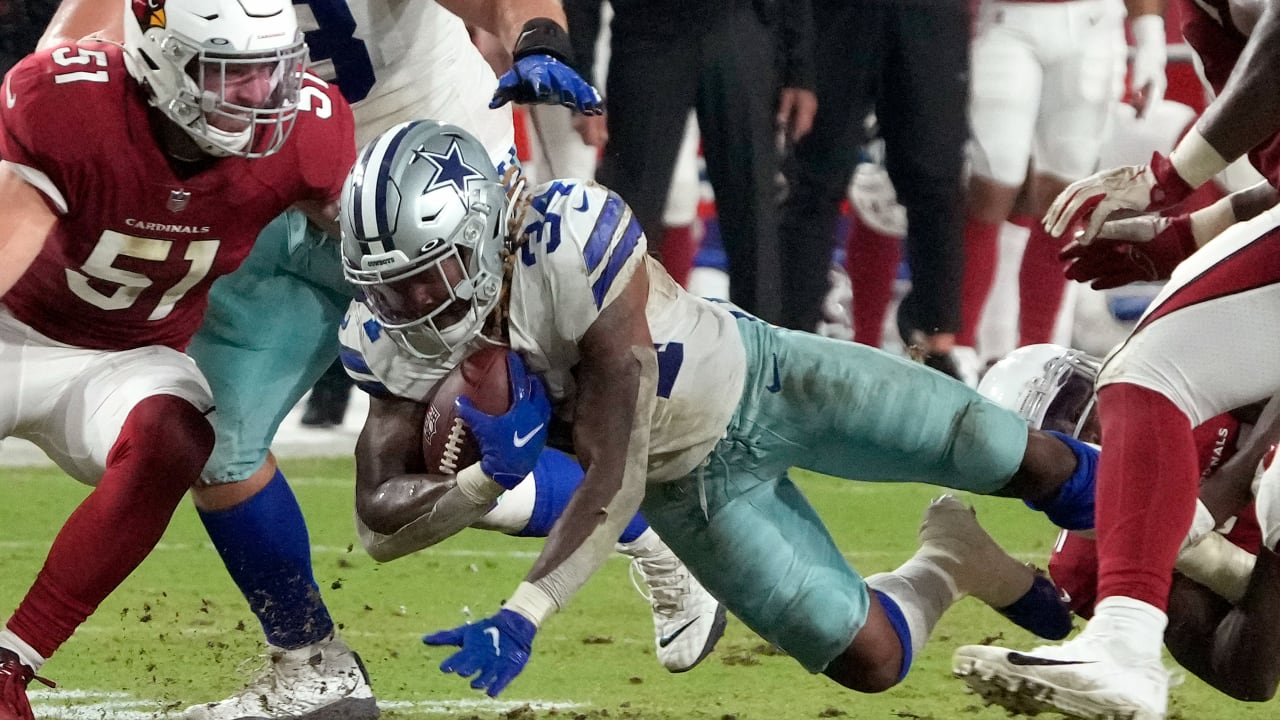 Dallas Cowboys running back Rico Dowdle plunges through a goal-line pileup  for rushing touchdown