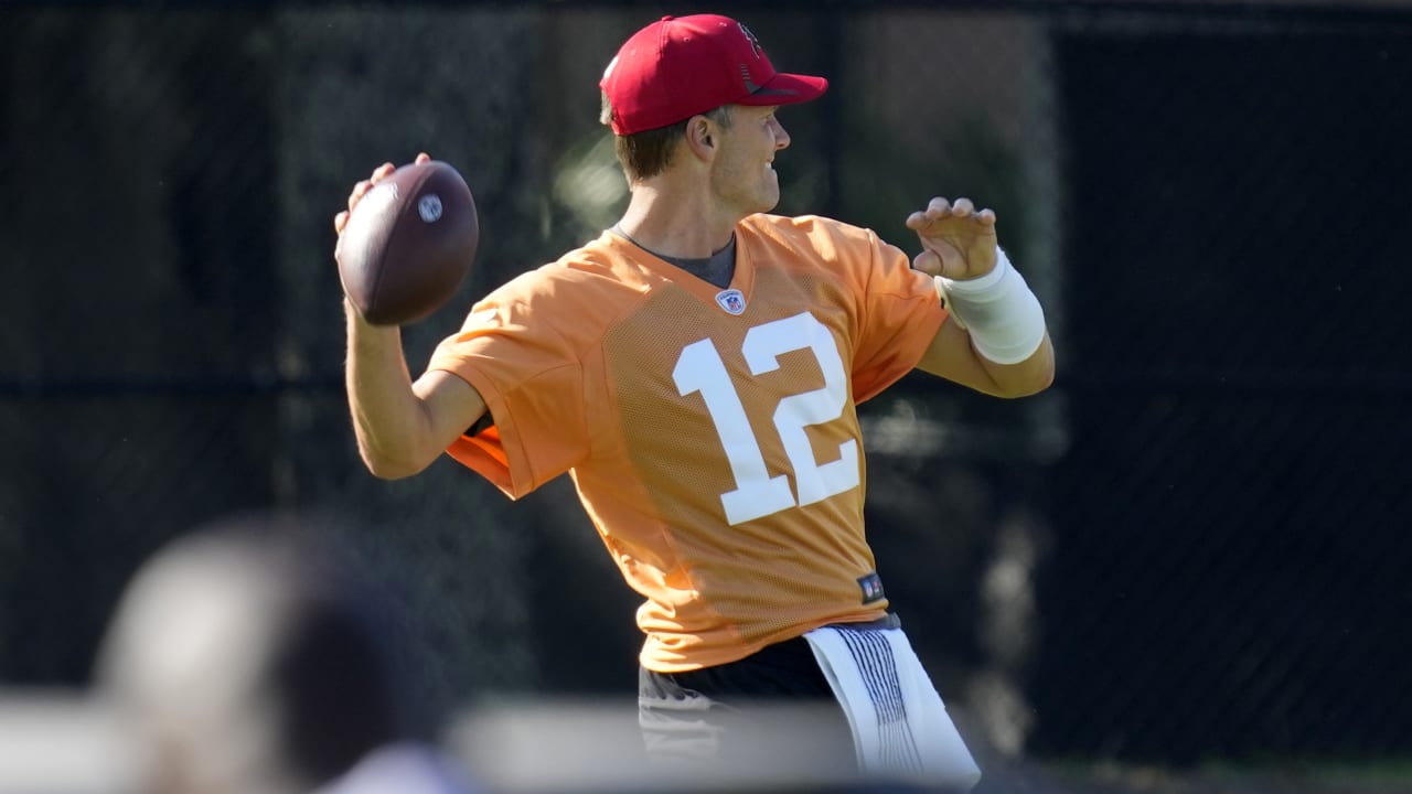 Tom Brady takes batting practice with Rob Gronkowski