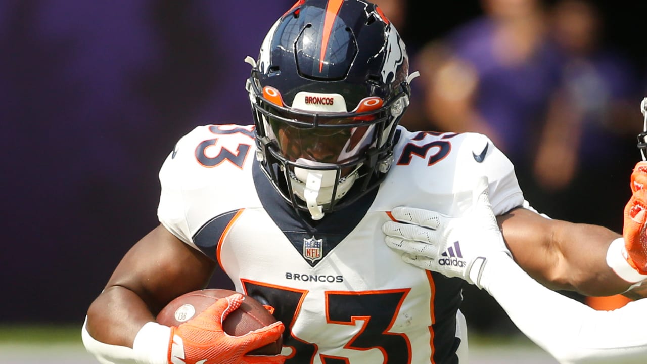 Denver Broncos running back Javonte Williams hurdles and flips his way