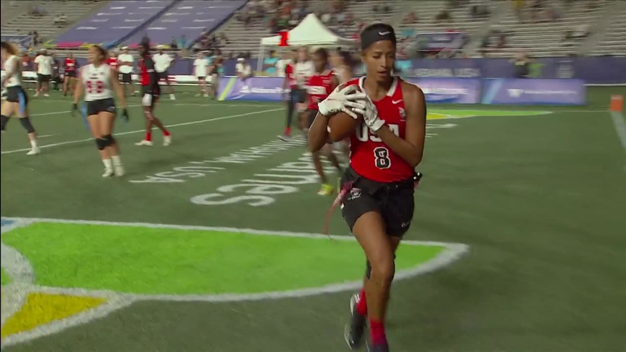 Flag football player Vanita Krouch flip tosses it up to Nadia Bibbs for