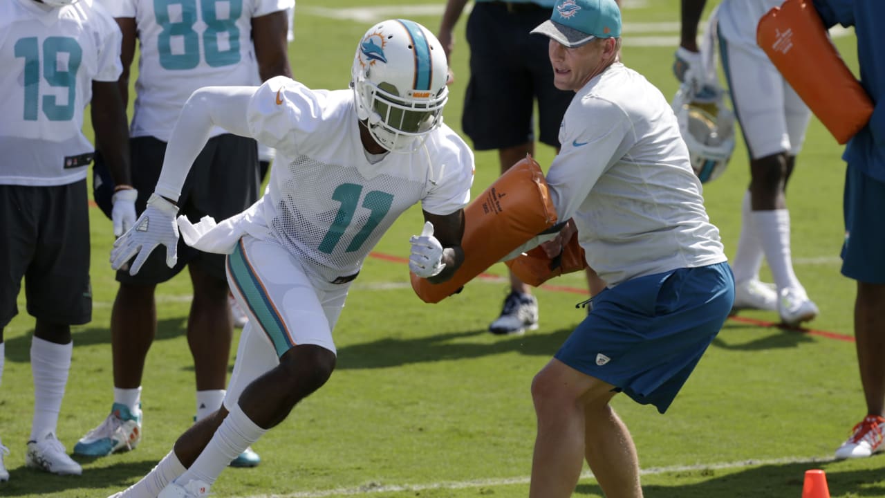 Miami Dolphins wide receiver DeVante Parker, right, stretches