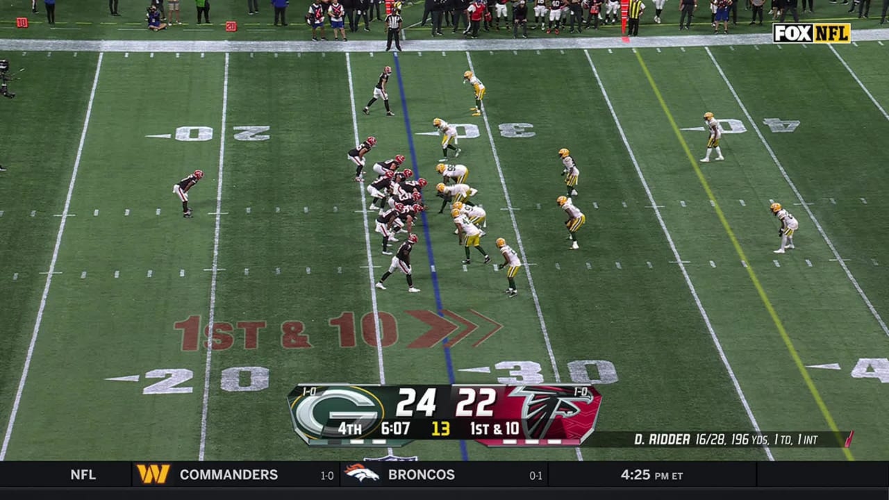 Atlanta Falcons wide receiver Drake London toasts Green Bay Packers defensive back Jaire