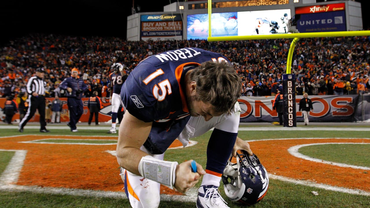 Jan. 8, 2012 - Denver, CO, USA - Denver Broncos QB TIM TEBOW runs for big  yardage against the Steelers during the 1st. half at Sports Authority Field  at Mile High Sunday