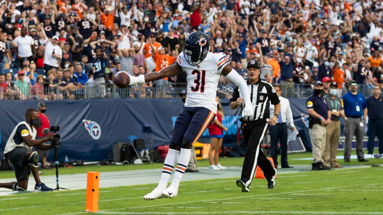 Chicago Bears defensive back Tre Roberson, left, scores a touchdown after  intercepting a pass against the Tennessee Titans in the first half of a  preseason NFL football game Saturday, Aug. 28, 2021