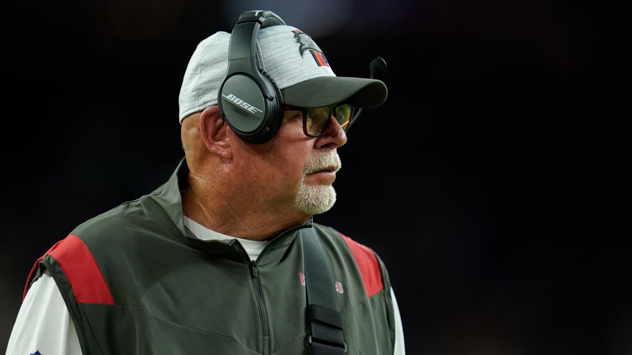 Bruce Arians looks like many things with face shield, headset and hat