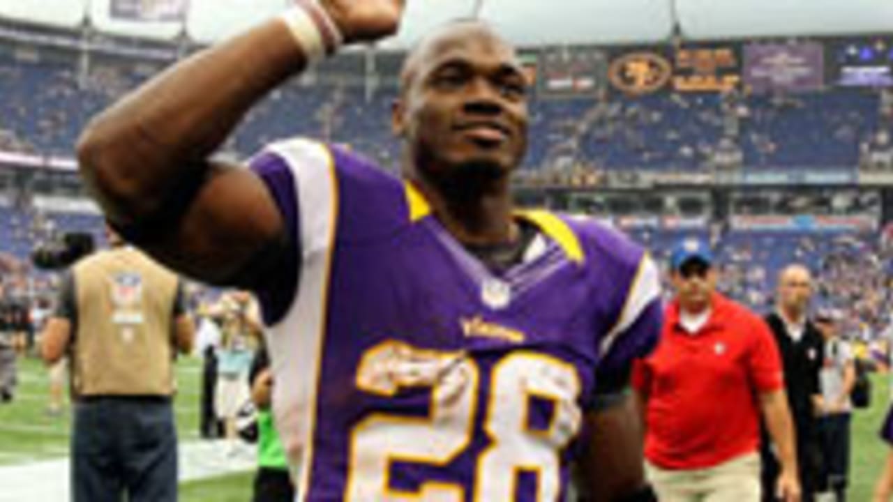 Minnesota Vikings running back Adrian Peterson smiles after winning the  2007 NFL Rookie of the Year award during a press conference at the NFL's  Super Bowl XLII media center in Phoenix on