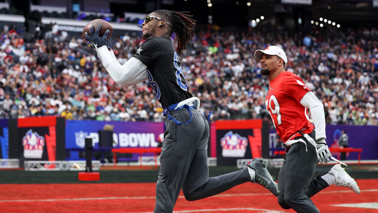 NFC wide receiver CeeDee Lamb, right, of the Dallas Cowboys, and AFC  cornerback J.C. Jackson, left, of the New England Patriots, reach for an  incomplete pass during the second half of the