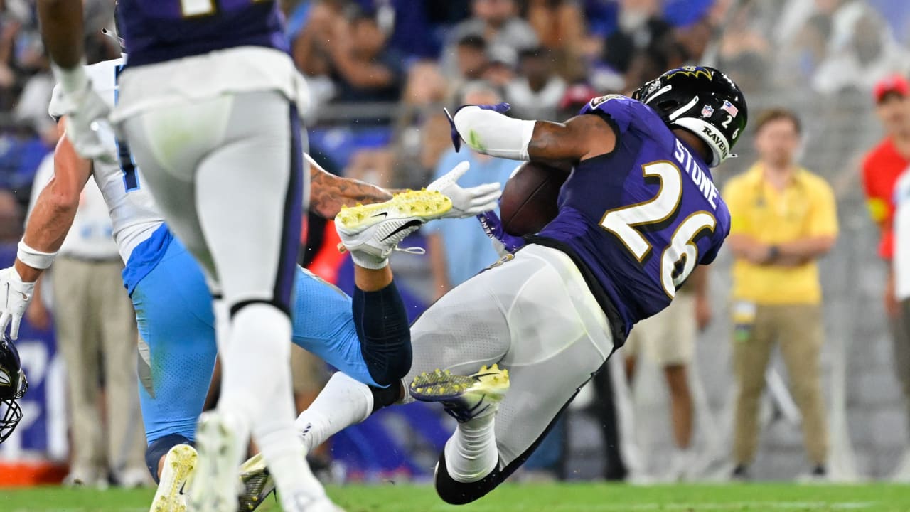 Baltimore Ravens safety Geno Stone secures a deflected interception for the  Ravens' third takeaway