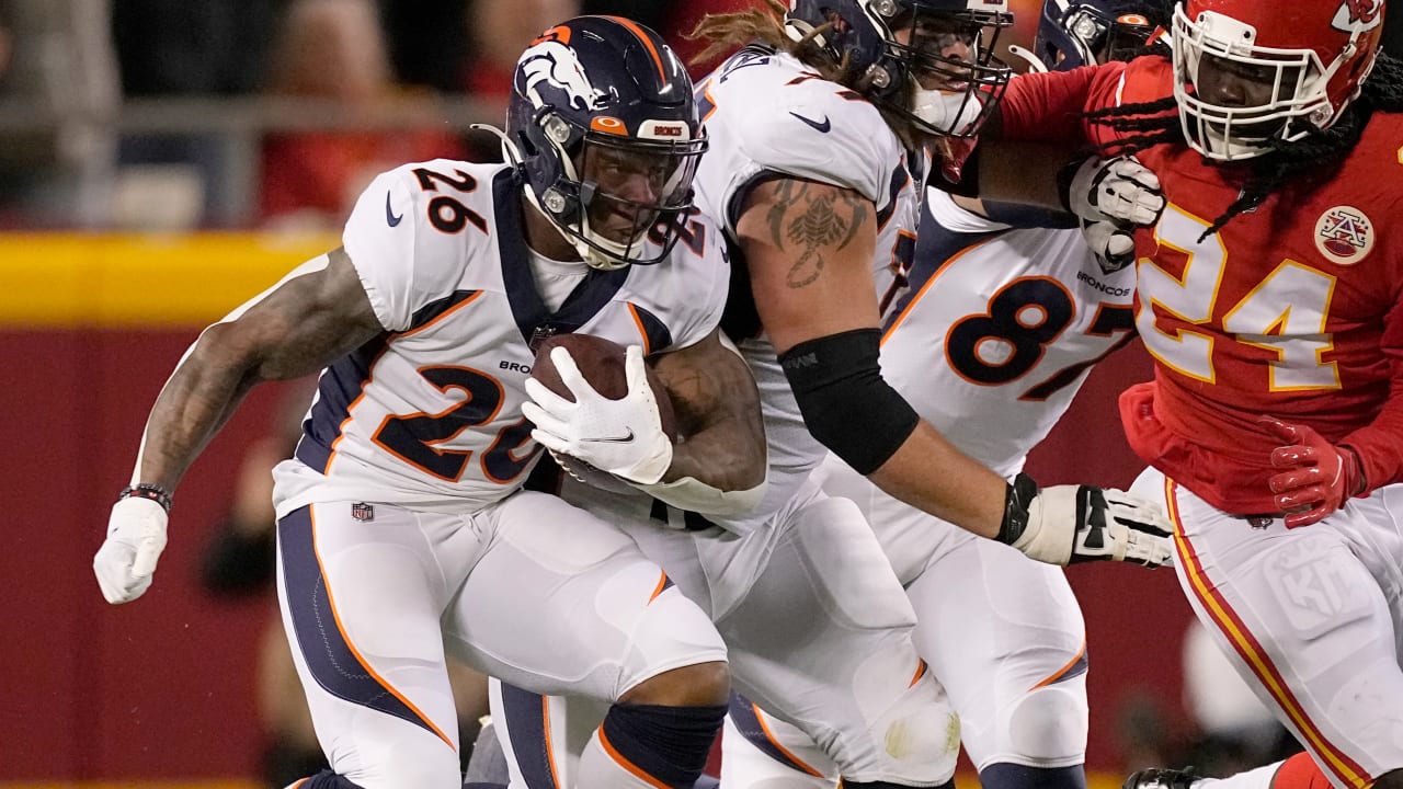 Denver Broncos running back Mike Boone looks to his teammates