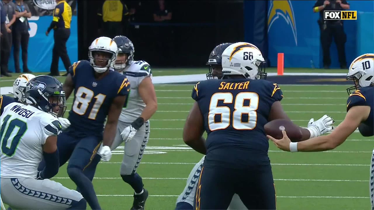 Seattle Seahawks linebacker Uchenna Nwosu crunches Los Angeles Chargers