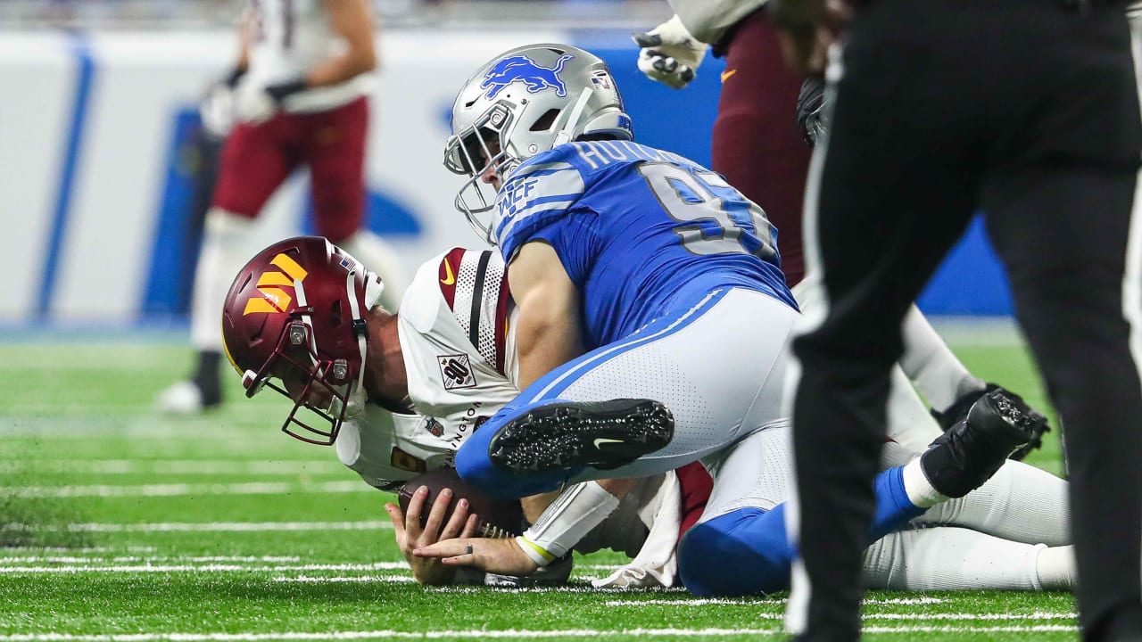 Detroit Lions defensive end Aidan Hutchinson delivers strip-sack