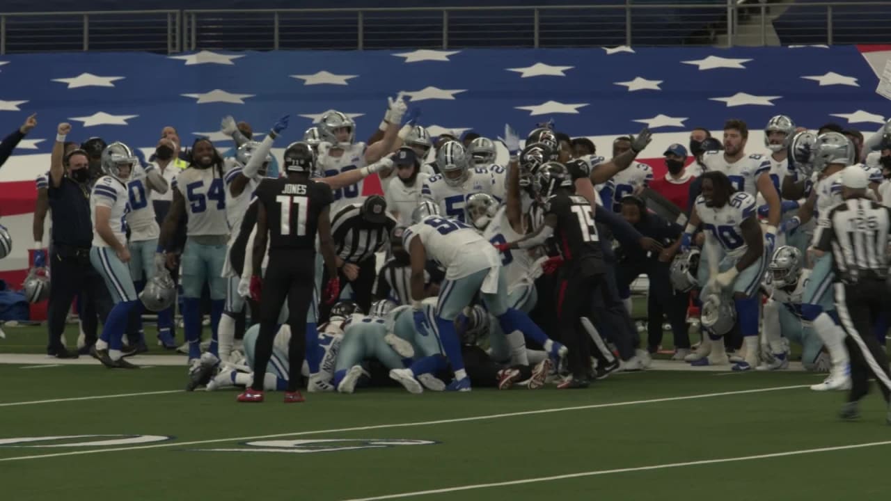 Field view Dallas Cowboys' sideline erupts after onside kick recovery