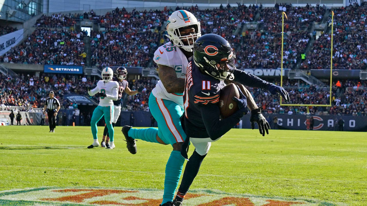 Chicago Bears wide receiver Darnell Mooney tries to break away from  Washington Commanders safety Bobby McCain during the first half of an NFL  football game in Chicago, Thursday, Oct. 13, 2022. (AP