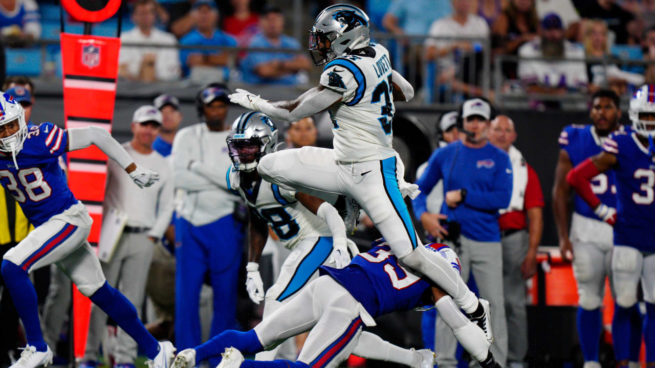 Carolina Panthers running back John Lovett (37) runs between Buffalo Bills  defensive tackle Prince Emili (94) and inebacker Andre Smith (9) during an  NFL preseason football game on Friday, Aug. 26, 2022