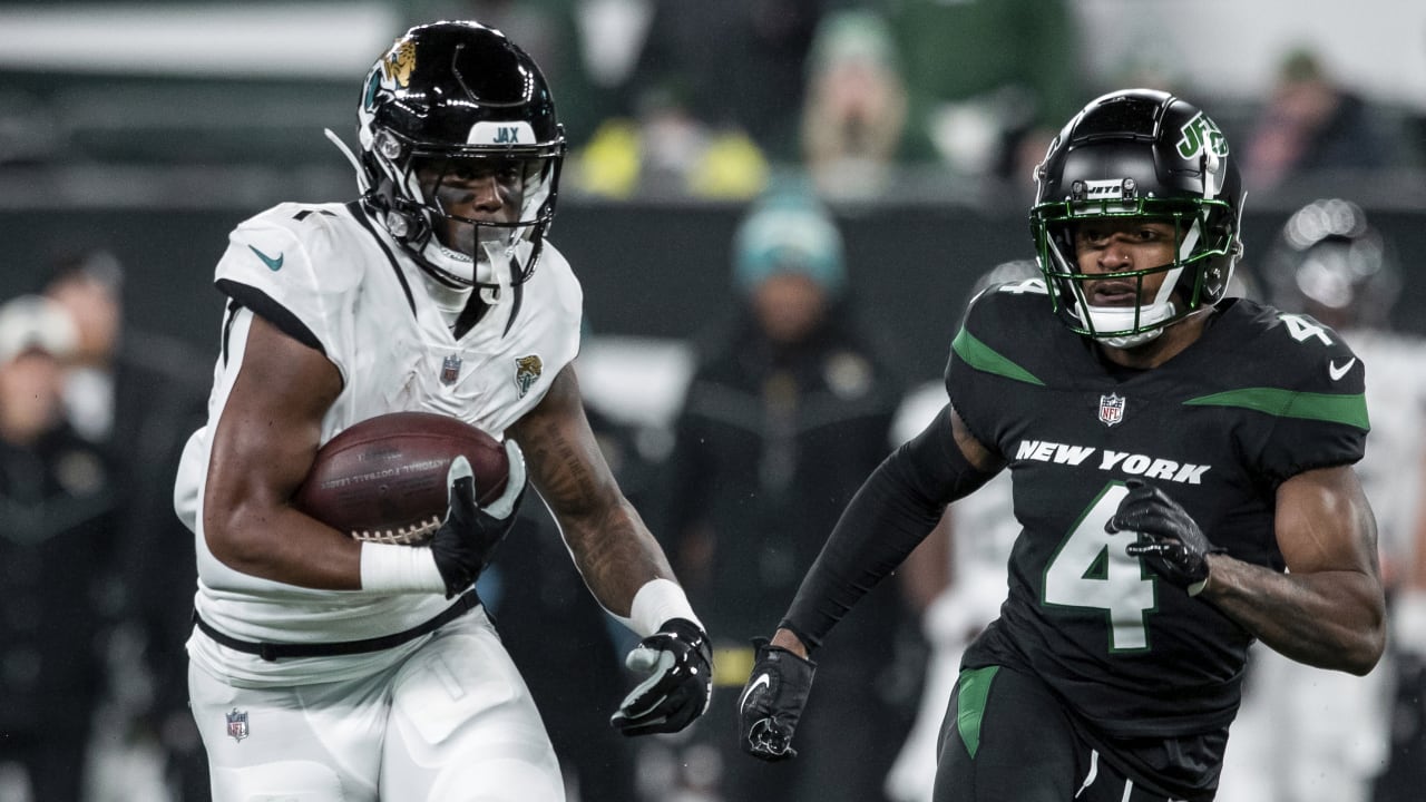 Jacksonville Jaguars running back Travis Etienne Jr., left, and Houston  Texans running back Dare Ogunbowale, right, exchange jerseys after an NFL  football game in Jacksonville, Fla., Sunday, Oct. 9, 2022. (AP Photo/Phelan