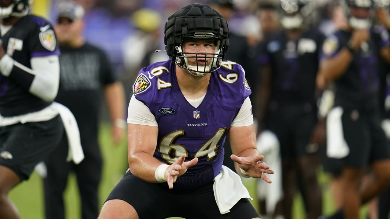 Center Tyler Linderbaum of the Baltimore Ravens looks on before