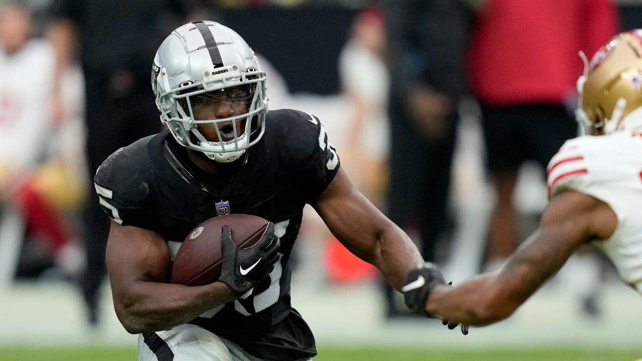 Running back Zamir White of the Las Vegas Raiders runs for first