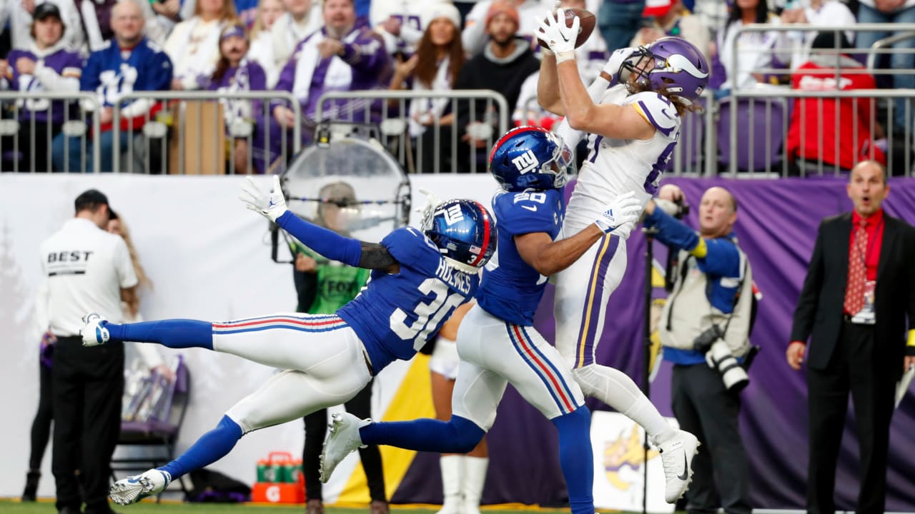 Minnesota Vikings tight end T.J. Hockenson (87) looks to catch a pass ahead  of Dallas Cowboys safety Donovan Wilson (6) during the first half of an NFL  football game, Sunday, Nov. 20