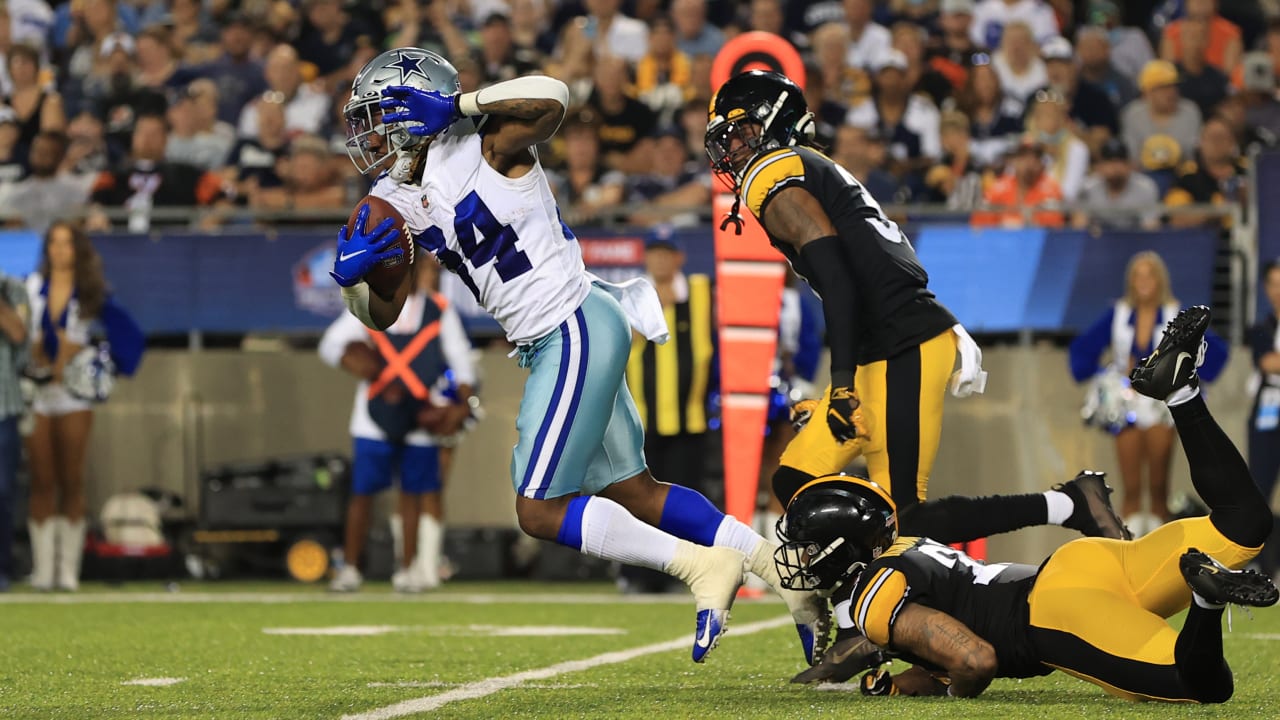 Dallas Cowboys running back Rico Dowdle plunges through a goal