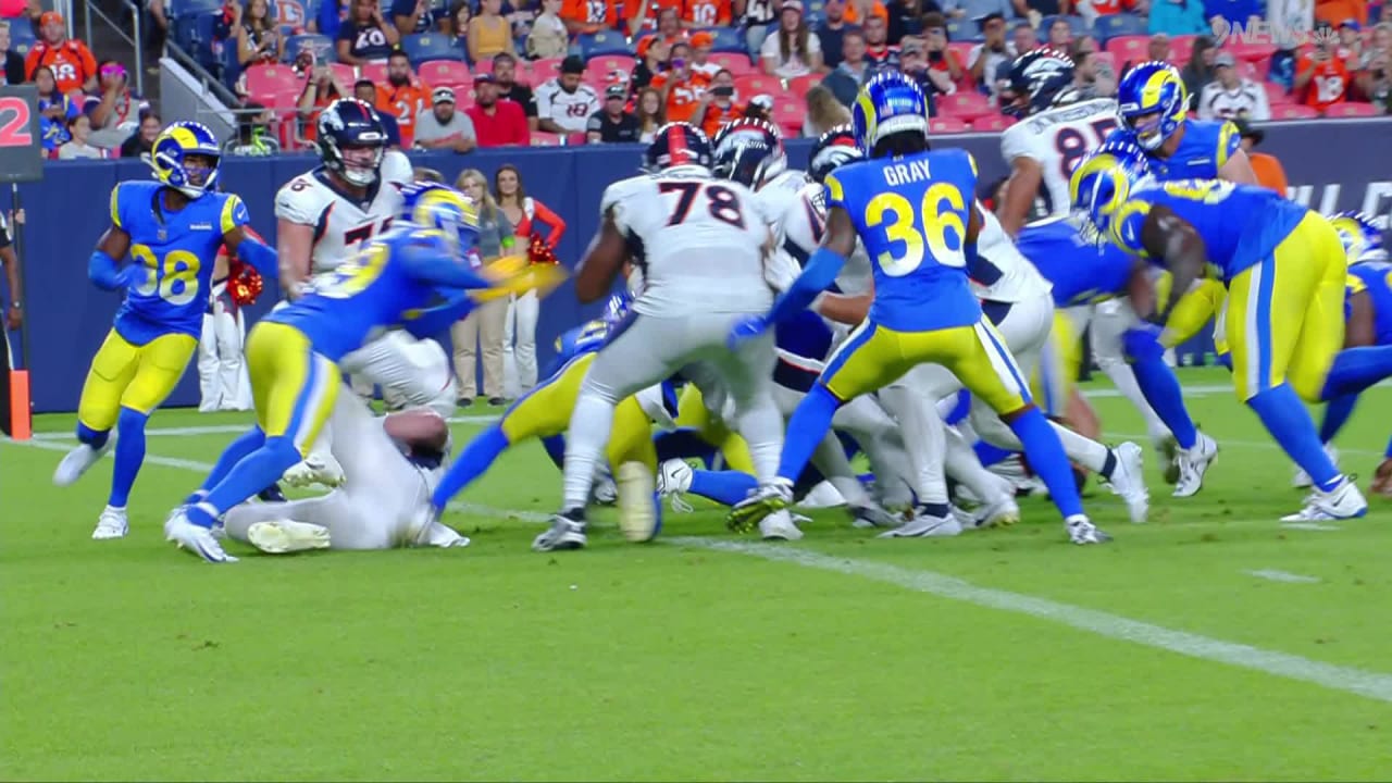 Tyler Badie of the Denver Broncos reacts after rushing for a