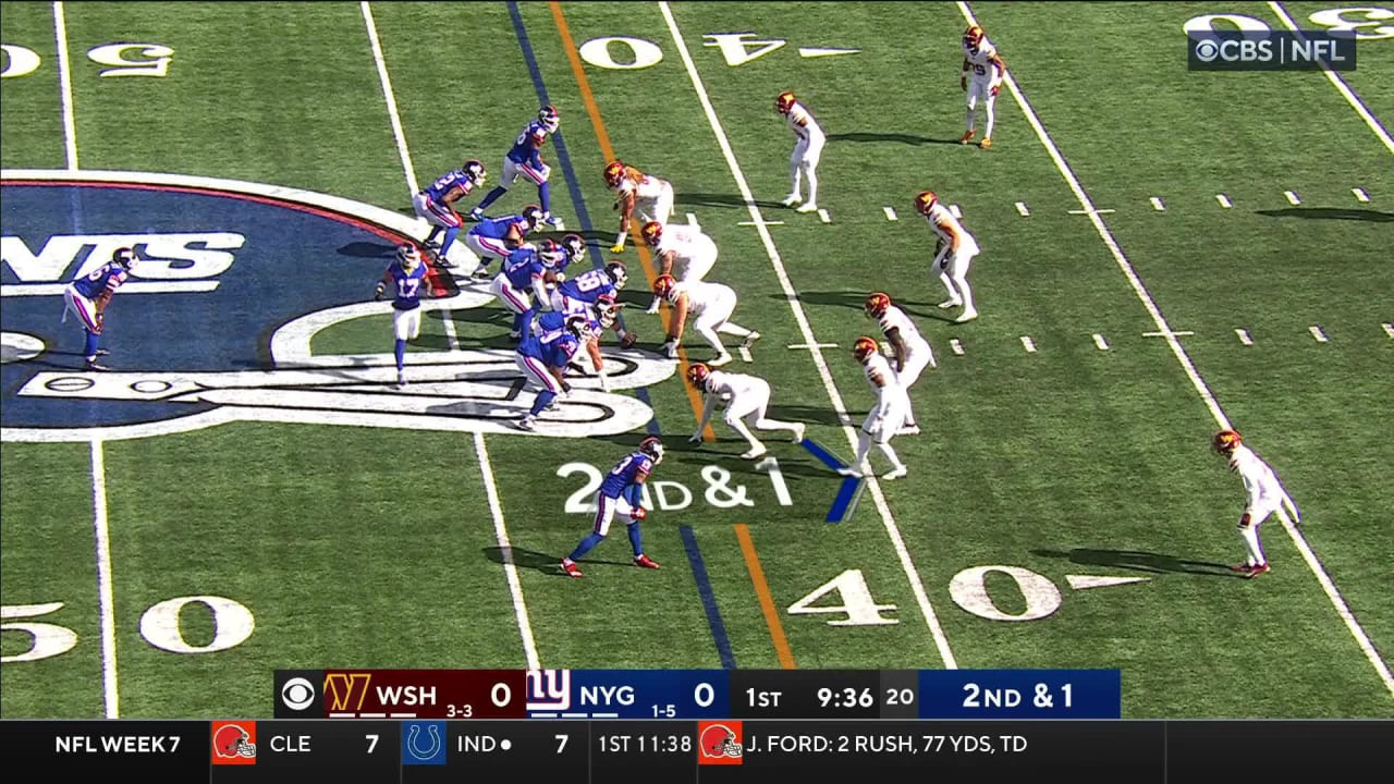 New York Giants running back Saquon Barkley holds left arm with