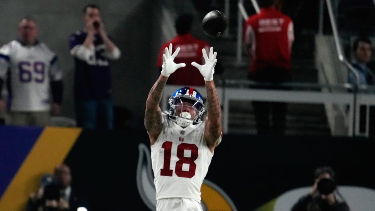 New York Giants wide receiver Isaiah Hodgins (18) runs with the ball  against the Washington Commanders during an NFL football game Sunday, Dec.  4, 2022, in East Rutherford, N.J. (AP Photo/Adam Hunger