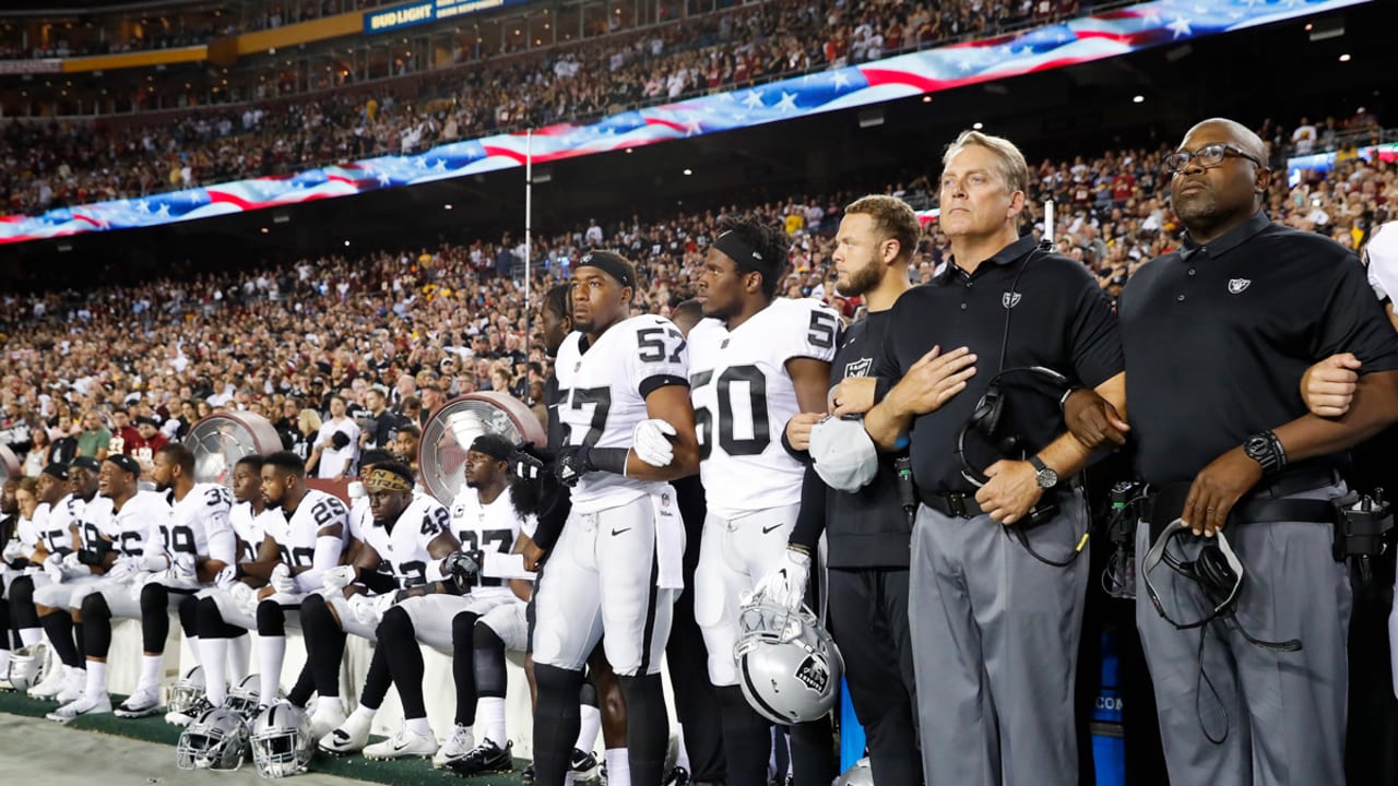 NFL: Raiders link arms, some Panthers kneel for national anthem