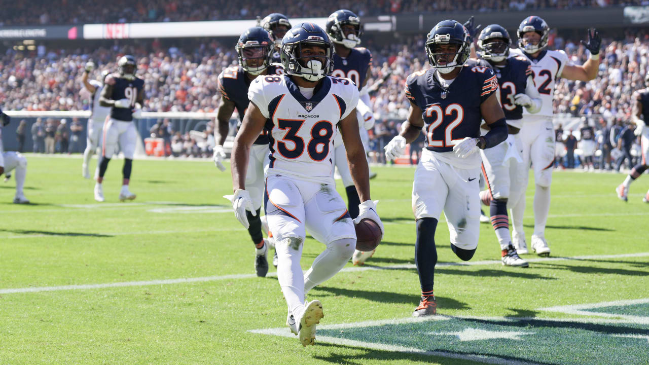 Denver Broncos running back Jaleel McLaughlin is tackled by Los