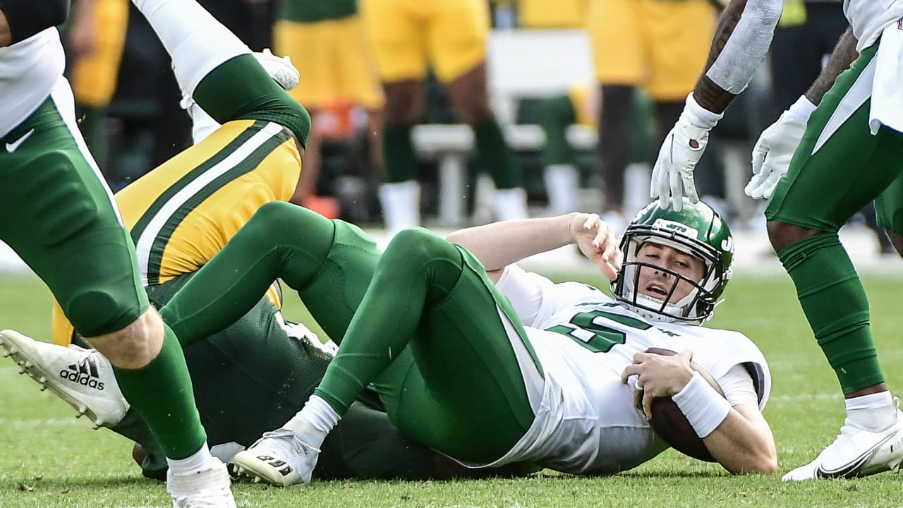 Green Bay Packers' T.J. Slaton runs a drill at the NFL football