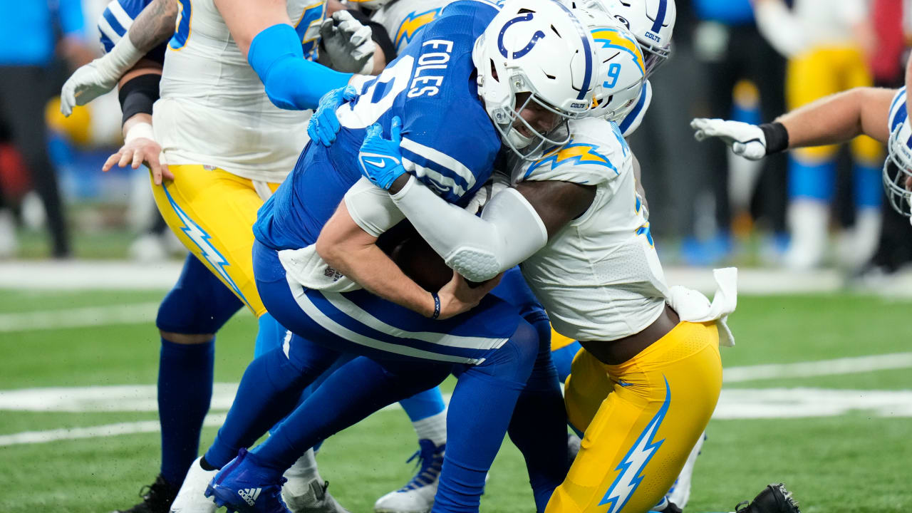 Defensive end Morgan Fox of the Carolina Panthers hits quarterback