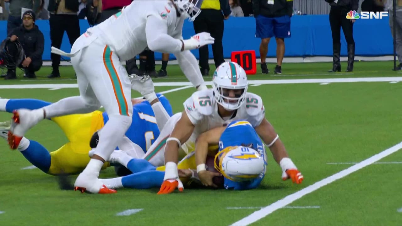 Miami Dolphins defensive end Jaelan Phillips' would-be sack on Los Angeles  Chargers quarterback Justin Herbert is called for roughing-the-passer  penalty via body weight