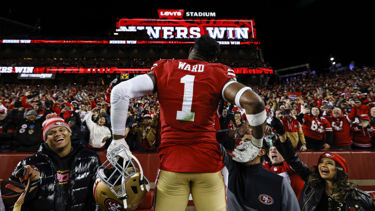 Dallas Cowboys wide receiver CeeDee Lamb (88) is tackled by San Francisco  49ers cornerback Jimmie Ward (1) during the first half of an NFL divisional  playoff football game in Santa Clara, Calif.