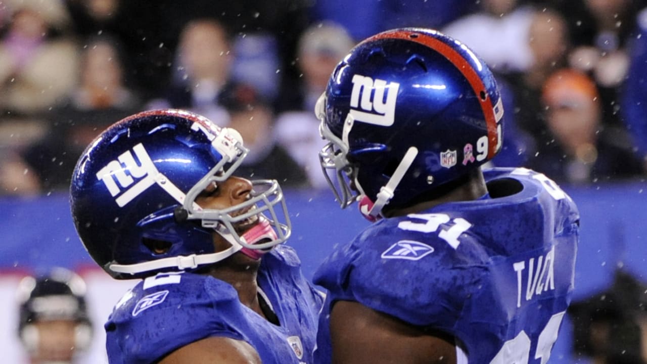 New York Giants linebacker Michael Boley (59) celebrates with safety Kenny  Phillips (21) after Phillips broke up a passing play during first half NFL  action between the New York Giants and the