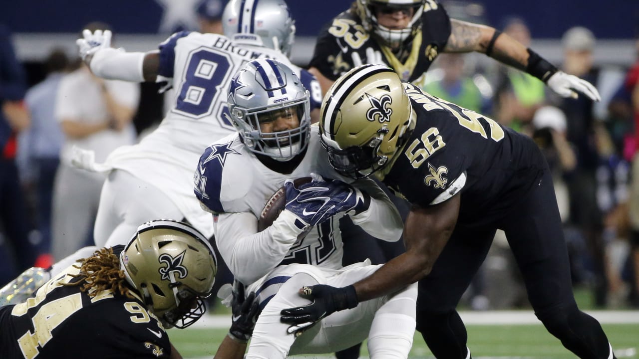 Dallas Cowboys cornerback Jourdan Lewis (27) celebrates his interception of  a pass by New Orleans Saints quarterback Drew Brees during the second half  of an NFL football game, in Arlington, Texas, …