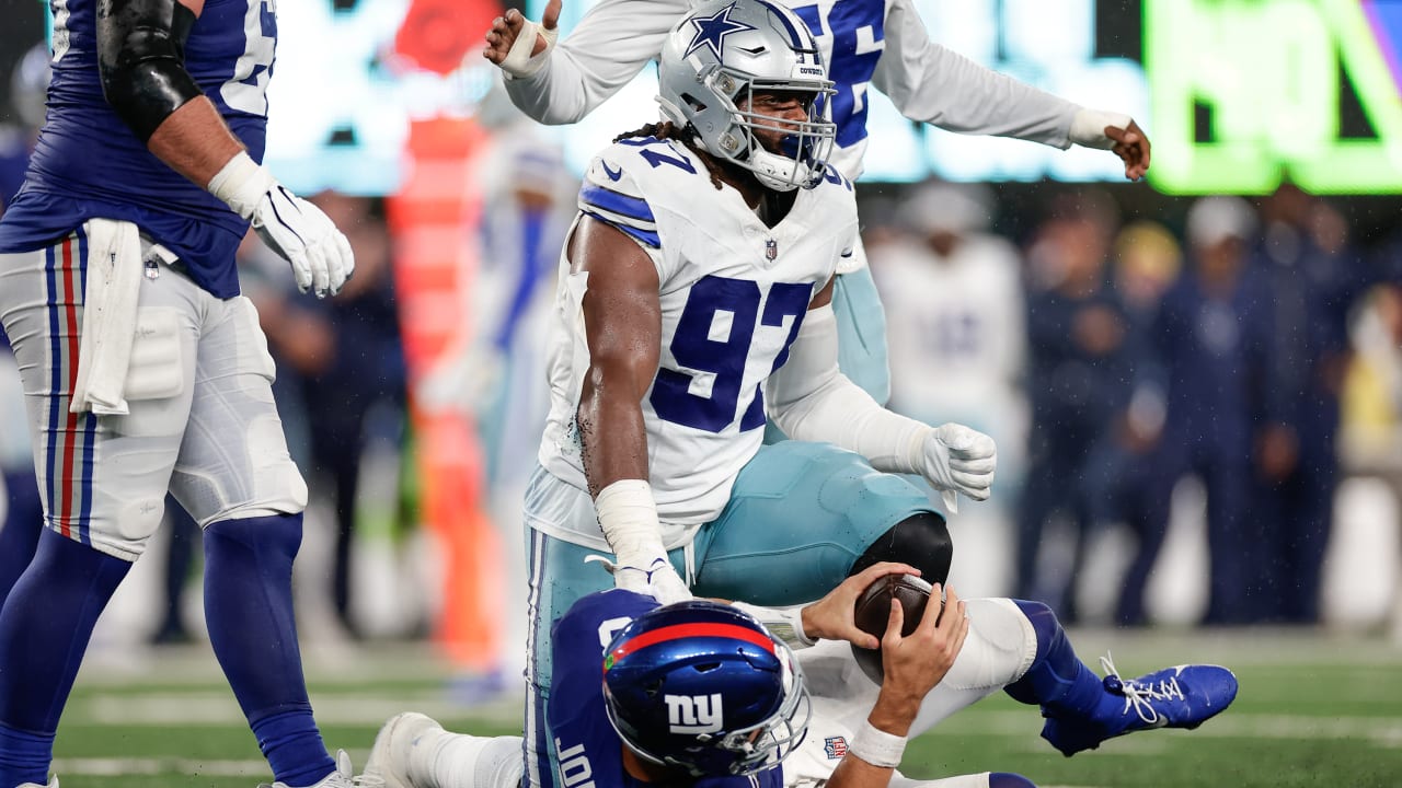 Dallas Cowboys defensive lineman Osa Odighizuwa rains on the New York Giants'  parade for a sack on Giants quarterback Daniel Jones