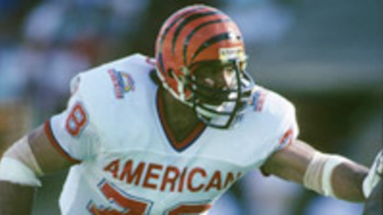 Cincinnati Bengals running back Rudi Johnson points to a group of