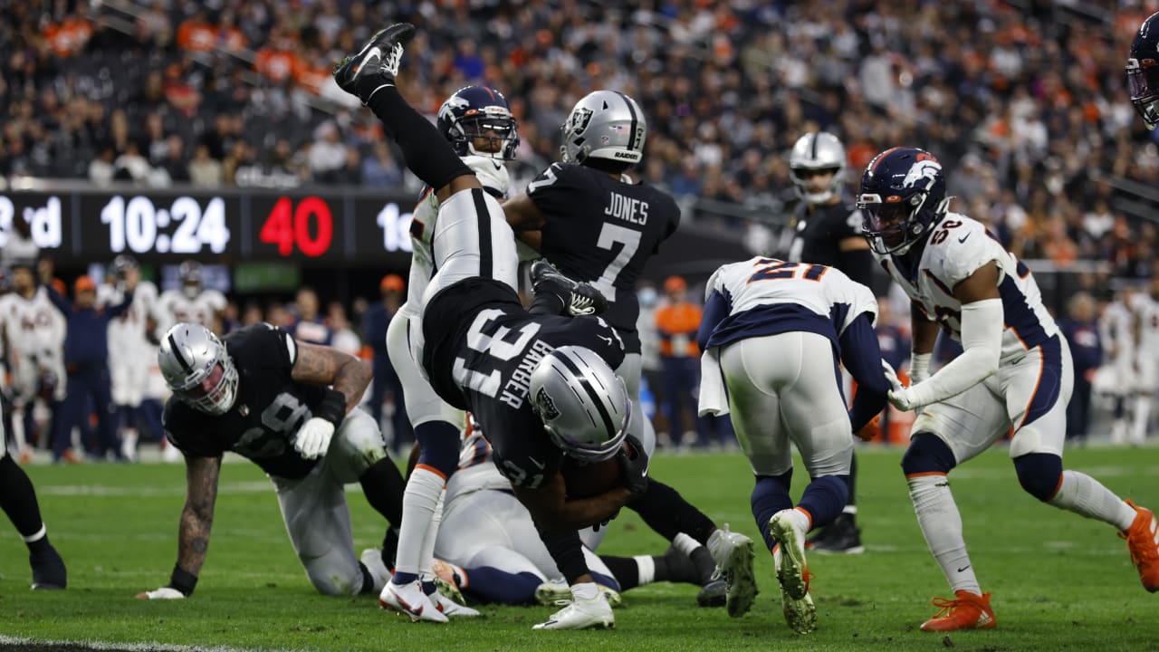 Las Vegas Raiders running back Peyton Barber does a headstand flip