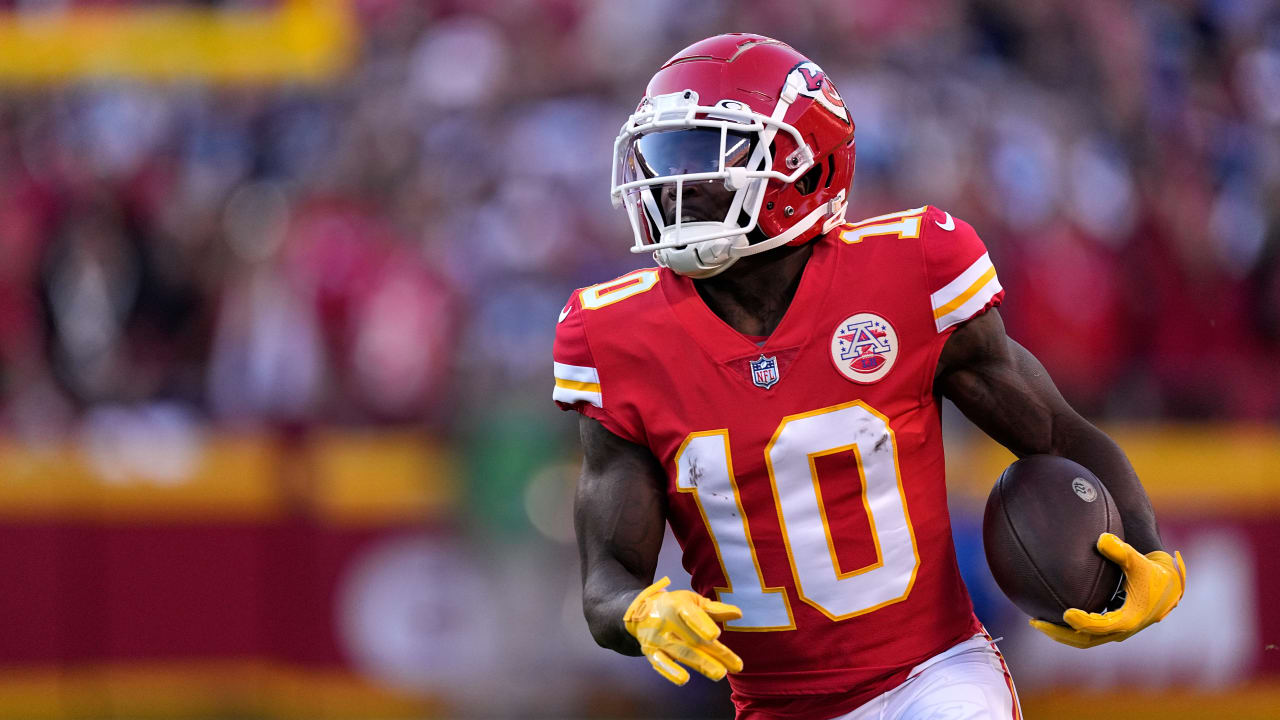 Wide receiver Tyreek Hill #10 of the Kansas City Chiefs makes a catch in  front of linebacker …