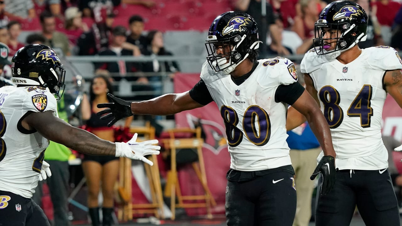 Baltimore Ravens tight end Isaiah Likely (80) runs with the ball